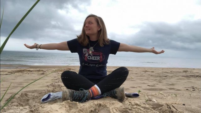 Amanda McCarthy sitting on the beach

