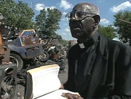 Reverend Elsworth Barclay preaching in junkyard