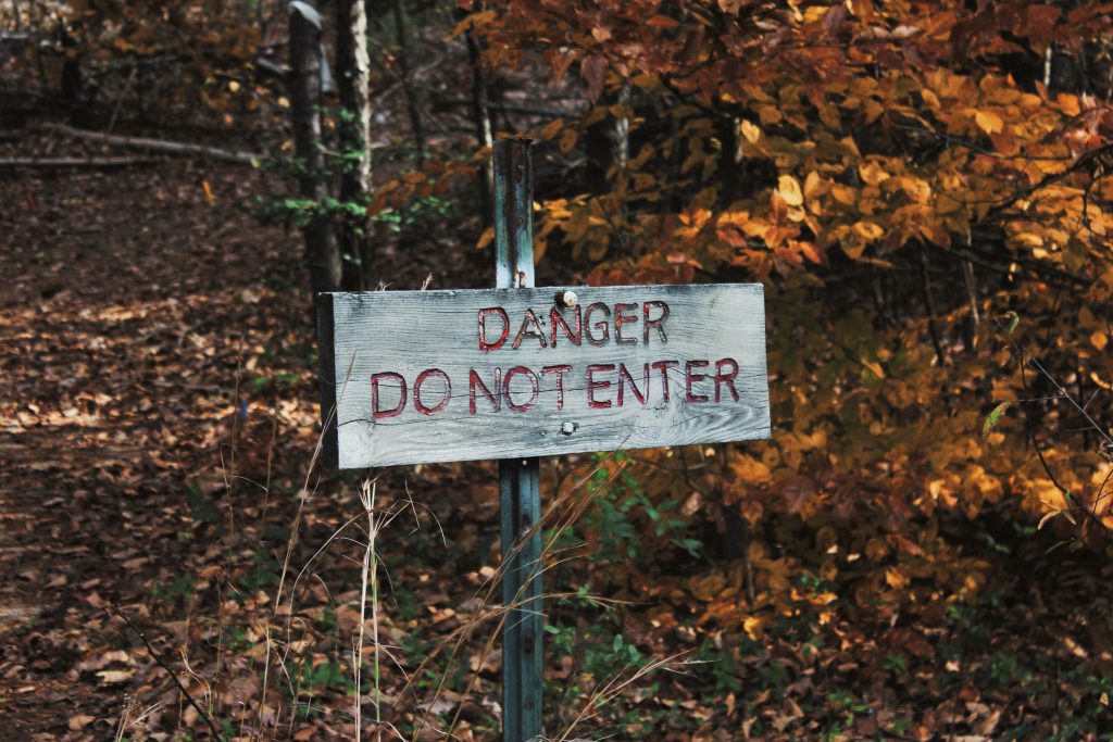 sign displaying the words "danger: do not enter"