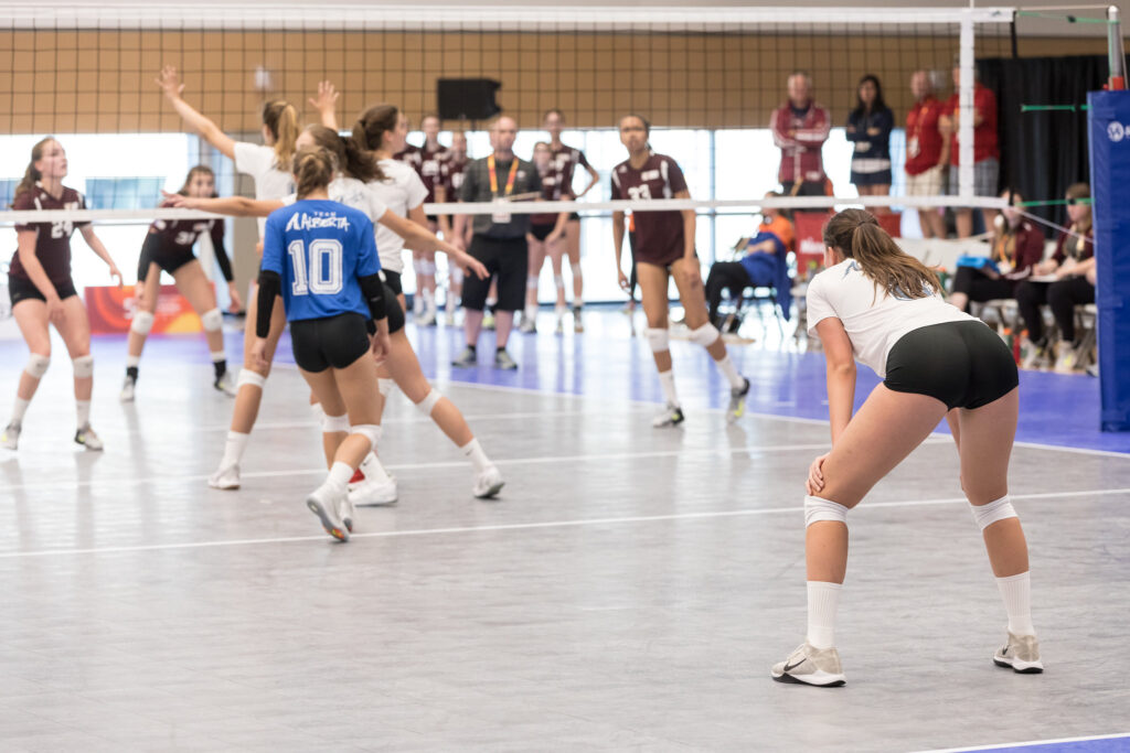 Women's volleyball players in a match.